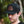 Load image into Gallery viewer, Person wearing a black trucker-style hat with a leather patch on the front that reads 'Kentzo Koffee' alongside a mountain logo and the phrase 'Fuel Your Adventure.' The background features soft-focus greenery, creating a natural, outdoorsy vibe.