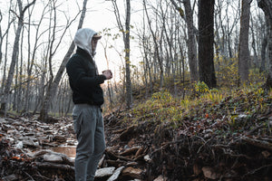 Drinking a cup of coffee during sunrise in the outdoors